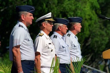 (left to right) GEN Ronald Fogelman, Air Force CHIEF of STAFF, ADM Joseph Prueher, CINC PACOM, GEN John Lorber, and GEN Richard Myers, stand at attention during the National Anthem at the PACAF change of command ceremony. GEN Myers will replace GEN Lorber as COMPACAF