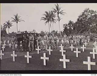 Soputa, New Guinea. 29 September 1943. Funeral procession of Brigadier (Brig) R. B. Sutherland moving into the cemetery. Shown: NX171 Brig A. Torr (1); Warrant Officer Class 1 (WO1) W. K. Mathison ..