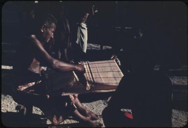 Weaving fibres on a loom : Tasman Islands, Papua New Guinea, 1960 / Terence and Margaret Spencer