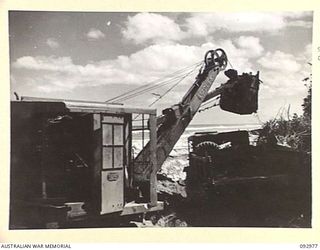 BOUGAINVILLE. 1945-05-31. AUSTRALIAN ENGINEERS OF 6 MECHANICAL EQUIPMENT COMPANY, ROYAL AUSTRALIAN ENGINEERS, ARE USING ALL TYPES OF EQUIPMENT TO ASSIST THEM IN THEIR JOB OF OPENING UP A ..