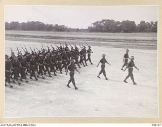 TOROKINA, BOUGAINVILLE. 1945-10-22. A CEREMONIAL PARADE AND MARCH PAST BY 29 INFANTRY BRIGADE WAS HELD FOR MAJOR-GENERAL BRIDGEFORD, GENERAL OFFICER COMMANDING 3 DIVISION, AT TOROKINA AIRFIELD. ..