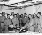 University of Washington team with equipment, probably on board the USS CHILTON, 1947