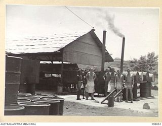 RABAUL, NEW BRITAIN, 1945-10-17. PERSONNEL OF SECTION 2, 8 FIELD BAKING PLATOON AT THEIR BAKEHOUSE IN HEADQUARTERS 11 DIVISION AREA