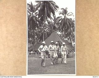 DREGER HARBOUR, NEW GUINEA. 1943-12-05. FOUR OFFICERS OF HEADQUARTERS, UNITED STATES BASE "F" AND THE 22ND PORT HEADQUARTERS, UNITED STATES ARMY SERVICES OF SUPPLY. LEFT TO RIGHT: COLONEL HARRY ..