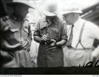 AITAPE, NORTH EAST NEW GUINEA. C. 1944-06. AIR COMMODORE F. R. W. SCHERGER, THE AIR OFFICER COMMANDING NO. 10 GROUP RAAF (LEFT), ARTHUR JOHN DEDMAN, THE MINISTER FOR WAR ORGANISATION OF INDUSTRY ..