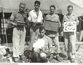 LAE BASE AREA, NEW GUINEA. 1944-12-24. PATIENTS OF THE 2/7TH AUSTRALIAN GENERAL HOSPITAL SHOWING SAMPLES OF THEIR WORK WHICH THEY EXHIBITED AT THE UNIT ARTS AND CRAFTS EXHIBITION. THIS EXHIBITION ..