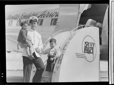 Qantas Empire Airways, Bird of Paradise Service flight steward C J Breen with the Ching children, Papua New Guinea