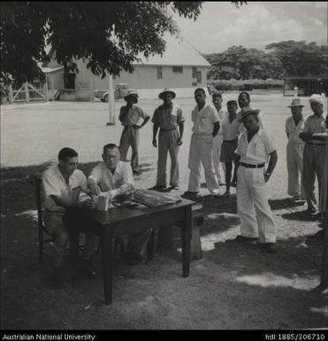 Farmers collecting wages