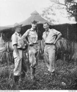 Goodenough Island, New Guinea. 1943. Left to right: Clement Seale, an Australian soldier artist; Robert Emerson Curtis, Camouflage Officer attached to the RAAF and later an Official War Artist; and ..