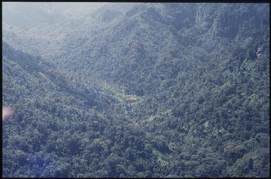 Aerial view of villages (3) : Helicopter flight, Bougainville Island, Papua New Guinea, 1971 / Terence and Margaret Spencer