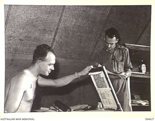 LAMARIEN, HENRY REID BAY, NEW BRITAIN, 1945-07-29. THE UNIT MAGAZINE BEING PRINTED IN THE ORDERLY ROOM AT HEADQUARTERS 2/2 COMMANDO SQUADRON, BY TROOPER T.E. CHOLERTON (1) AND LANCE-SERGEANT G.B. ..