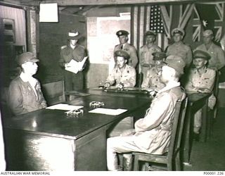 THE SOLOMON ISLANDS, 1945-09-08. LIEUTENANT GENERAL MASATANE KANDA, COMMANDER JAPANESE XVII ARMY, AND VICE ADMIRAL BARON TOMOSHIGE SAMEJIMA, COMMANDER JAPANESE EIGHTH FLEET, SEATED AT THE SURRENDER ..