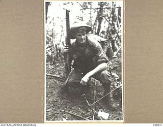 FARIA VALLEY, NEW GUINEA, 1943-10-17. WX7752 PRIVATE A.J. CARLSON OF THE 2/16TH AUSTRALIAN INFANTRY BATTALION AT JOHN'S KNOLL