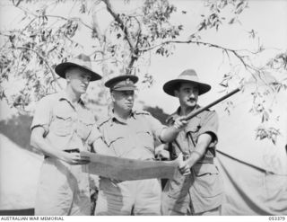 DONADABU, SOGERI VALLEY, NEW GUINEA. 1943-06-28. OFFICERS OF HEADQUARTERS STAFF, 7TH AUSTRALIAN INFANTRY BRIGADE. LEFT TO RIGHT: NX70799 CAPTAIN (CAPT) A. G. LOUNDES, BRIGADE MAJOR LEARNER; TX2002 ..