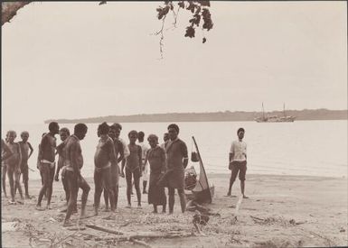Villagers on beach at Buala with Feros Island in background, Solomon Islands, 1906 / J.W. Beattie
