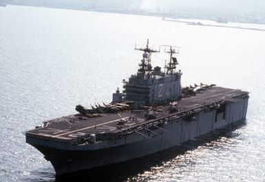 The amphibious assault ship USS SAIPAN (LHA 2) lies at anchor offshore during the NATO Southern Region exercise DRAGON HAMMER '90