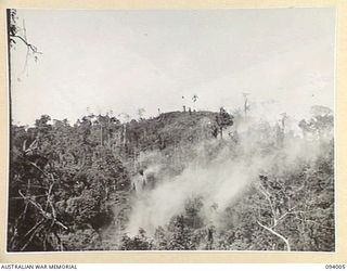 WEWAK AREA, NEW GUINEA, 1945-07-14. 2/1 FIELD REGIMENT AND 2/3 FIELD REGIMENT, FIRED 4,500 25-POUNDER SHELLS OVER A PERIOD OF 45 MINUTES. THIS WAS FOLLOWED BY 350 3-INCH MORTAR BOMBS AND 500 ROUNDS ..