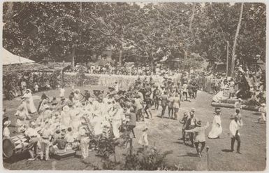 Cook Islanders dressed in white and in military uniforms performing