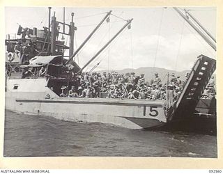 BOUGAINVILLE. 1945-05-25. TROOPS OF 42 LANDING CRAFT COMPANY CARRYING 31/51 INFANTRY BATTALION TROOPS MOVING INTO SHORE FOR THE LANDING ON THE BEACH AT SORAKEN PENINSULA