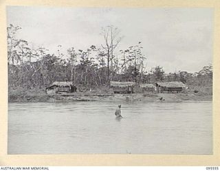 MIVO RIVER, BOUGAINVILLE, 1945-08-29. AFTER JAPANESE ENVOYS HAD OPENED SURRENDER NEGOTIATIONS ON 1945-08-18, AN AUSTRALIAN CAMP, UNDER MAJOR K.V.L. KESTEVEN, 15 INFANTRY BATTALION, AND A JAPANESE ..