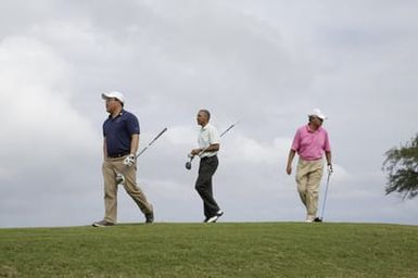 Barack Obama plays golf with Prime Minister Najib Razak, Joe Paulsen, and Mike Brush in Kaneohe Bay, Hawaii, December 24, 2014