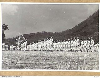 17 MILE, PORT MORESBY AREA, NEW GUINEA. 1943-12-24. PERSONNEL OF THE 10TH AUSTRALIAN ADVANCED ORDNANCE DEPOT ON PARADE FOR AN INSPECTION BY VX247 BRIGADIER C. A. STINSON, DEPUTY DIRECTOR OF ..