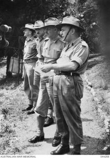 WAU, NEW GUINEA, 1944-09/10. (LEFT TO RIGHT); LT -COL G.A. BERTRAM G (OPERATIONS) NGF LT-COL ANDERSON, HQ ROYAL AUSTRALIAN ARTILLERY NGF, LT-GEN I. MACKAY, BRIG M.J. MOTEN, COMD KANGA FORCE. ..