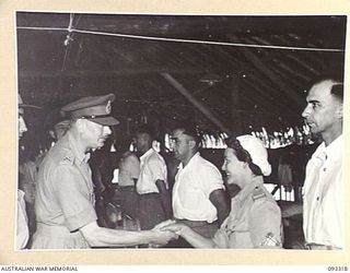 LAE AREA, NEW GUINEA, 1945-06-28. HIS ROYAL HIGHNESS, THE DUKE OF GLOUCESTER, GOVERNOR GENERAL OF AUSTRALIA (1) VISITING ONE OF THE WARDS AT 2/7 GENERAL HOSPITAL, DURING HIS TOUR OF INSPECTION OF ..