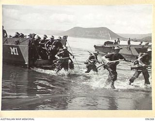 MALAGUNA MISSION, SOUTH OF RABAUL, NEW BRITAIN. 1945-09-10. TROOPS OF 29/46 INFANTRY BATTALION, COMING ASHORE. THE TROOPS WILL OCCUPY THE RABAUL AREA, FOLLOWING THE SURRENDER OF THE JAPANESE