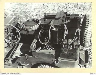 BOUGAINVILLE ISLAND. 1945-02-22. A SLAVE CHARGER FITTED INTO A JEEP OF B SQUADRON WORKSHOP, 2/4TH ARMOURED REGIMENT. THE DESIGN AND FITTING OF THESE UNITS WAS DONE BY THE UNIT WORKSHOP PERSONNEL