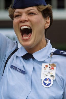 CHIEF MASTER Sergeant (MSGT) Glenda Shepela bids farewell to a Chinese People's Liberation Army Air Force Song and Dance Troupe as they depart for China aboard a US Air Force aircraft. The troupe performed in Hawaii on the final stop of its US tour