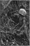 Hunting: Akis setting a snare in forest