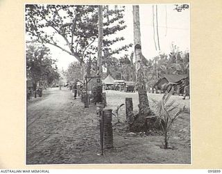 WIRUI BEACH, WEWAK, NEW GUINEA. 1945-09-04. THE TRANSPORT LINES AND UNIT SIGNBOARD OF 2/11 INFANTRY BATTALION