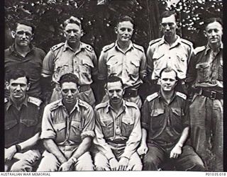 Portrait of officers of the New Guinea Air Warning Wireless Company (NGAWW). Left to right, back row: Lieutenant (Lt) Mitchell; Lt Pomroy [Pomeroy?]; Lt Hopkins; Lt Peter Evatt; Lt McBurney. Front ..