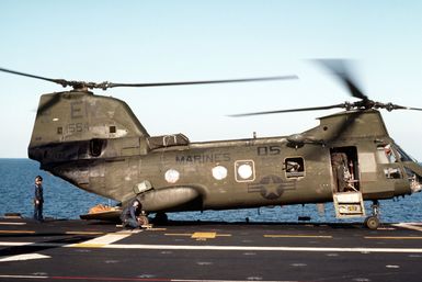 A CH-46E Sea Knight helicopter from Marine Medium Helicopter Squadron 261 is prepared for takeoff from the amphibious assault ship USS GUAM (LPH 9) during operations off the coast of Lebanon