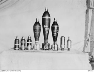 FINSCHHAFEN - SIO AREA, NEW GUINEA. 1944-03-31. JAPANESE AMMUNITION COLLECTED FROM DUMPS IN THE AREA BY THE CHIEF ENGINEER'S BRANCH, HEADQUARTERS 2ND AUSTRALIAN CORPS. THE AMMUNITION DISPLAYED, ..