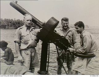 Goodenough Insland, New Guinea. 1942-08. This anti-aircraft gun crew of the "Maclaren King" helped beat off a Japanese air attack. They are Gunner A. Lobban of Flinders Victoria, Sergeant B. ..