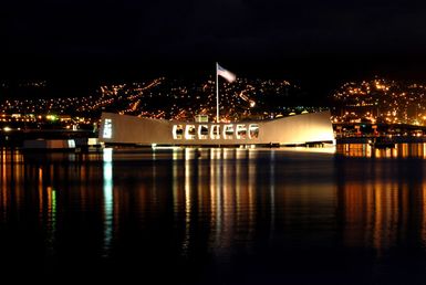 The city lights of Aiea, Hawaii, is the backdrop for USS ARIZONA Memorial, the morning prior to the joint U.S. Navy/National Park Service ceremony commemorating the 65th anniversary of the attack on Pearl Harbor, Hawaii, on Dec. 6, 2006. More than 1,500 Pearl Harbor survivors, their families and friends from around the nation will join more than 2,000 distinguished guests and the general public for the annual observance. (U.S. Navy PHOTO by Mass Communication SPECIALIST 1ST Class James E. Foehl) (Released)