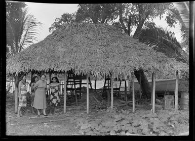 Aggie Grey with three unidentified women, next to Samoan hut (fale), Apia, Samoa