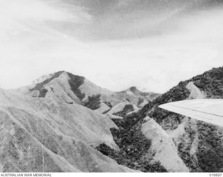 Finisterre Range, New Guinea. 1943. Shaggy Ridge seen from a United States Flying Fortress aircraft which reconnoitred the battleground. A shot from the Department of Information film 'Jungle ..