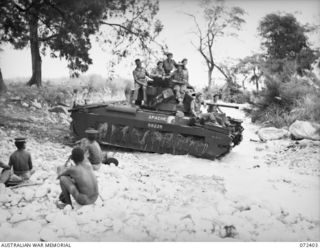 WANDOKAI, NEW GUINEA. 1944-04-17. "APACHE", A MATILDA TANK OF "A" SQUADRON, 1ST TANK BATTALION, ARMED WITH A 2 POUNDER GUN, CROSSES A CREEK AFTER COMPLETING A TRIAL SHOOT CONDUCTED BY THE ..