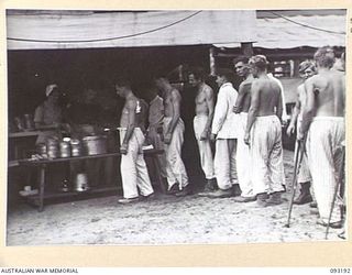 BOUGAINVILLE, 1945-06-18. WALKING PATIENTS AT 109 CASUALTY CLEARING STATION, MOTUPENA POINT, ON MESS PARADE