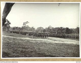 POM POM VALLEY, NEW GUINEA. 1943-11-30. GENERAL VIEW OF THE 2/12TH AUSTRALIAN INFANTRY BATTALION ON PARADE