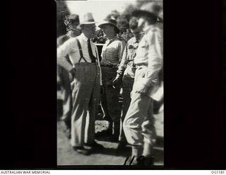 AITAPE, NORTH EAST NEW GUINEA. C. 1944-06. LEFT TO RIGHT: ARTHUR DRAKEFORD, THE MINISTER FOR AIR, JOHN DEDMAN, THE MINISTER FOR WAR ORGANISATION OF INDUSTRY, AND AIR COMMODORE F. R. W. SCHERGER, ..