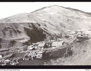 WAU-LABU ROAD, NEW GUINEA, 1946.01-12. THE PLATOON CAMP, LOOKING WESTWARD, OF 8 MECHANICAL EQUIPMENT COMPANY, ROYAL AUSTRALIAN ENGINEERS, AT MUMERG, FIFTY-FIVE MILES FROM LABU