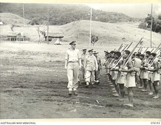 NADZAB, NEW GUINEA. 1944-09-26. VX13 LIEUTENANT-GENERAL S G SAVIGE, CB, CBE, DSO, MC, ED GOC NEW GUINEA FORCE (3) INSPECTING A PARADE OF NO 3 PLATOON, A COMPANY, 1ST NEW GUINEA INFANTRY BATTALION ..