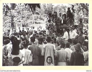 RABAUL AREA, NEW BRITAIN. 1945-09-13. CHINESE CIVILIANS, INTERNED BY THE JAPANESE AT A CAMP 15 MILES WEST OF RABAUL, WERE CONTACTED BY A PARTY OF AUSTRALIAN ARMY AND RED CROSS OFFICIALS SOON AFTER ..