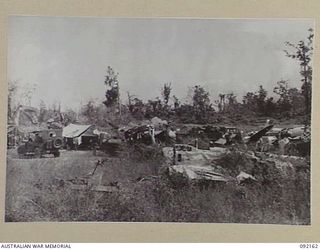 WEWAK AREA, NEW GUINEA. 1945-05-13. THE SCENE WITHIN 2/4 INFANTRY BATTALION AREA SHOWING WRECKED JAPANESE AIRCRAFT AT THE AIRSTRIP. THEY ARE MUTE EVIDENCE OF THE EFFECTIVENESS OF THE ALLIED AIR ..