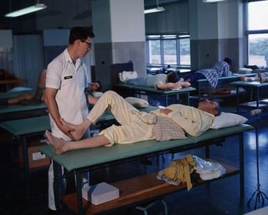 CAPT. (Dr.) Mark Hixson, Department of Dentistry, treats a patient at Tripler Army Medical Center