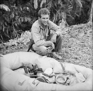 1943-10-02. NEW GUINEA. LAE. AREA. AMERICAN KITTYHAWK PILOT LIEUT. J. THORVALDSON OF SPOKANE, WASHINGTON, AND THE RUBBER BOAT ON WHICH HE FLOATED DOWN THE MARKHAM RIVER FROM THE JUNCTION OF THE ..